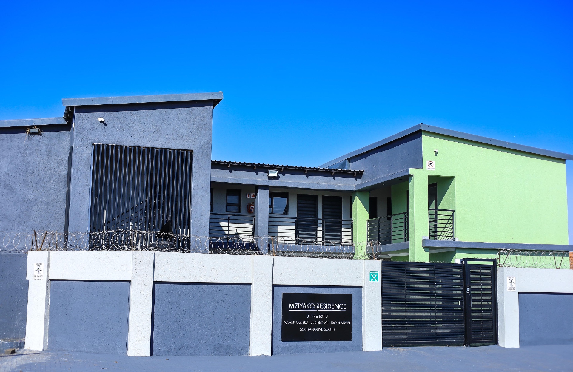 Mziyako Residence — full exterior, secure entrance and signage